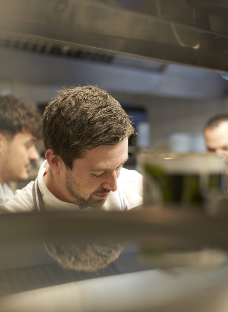 chef preparing food in a professional kitchen
