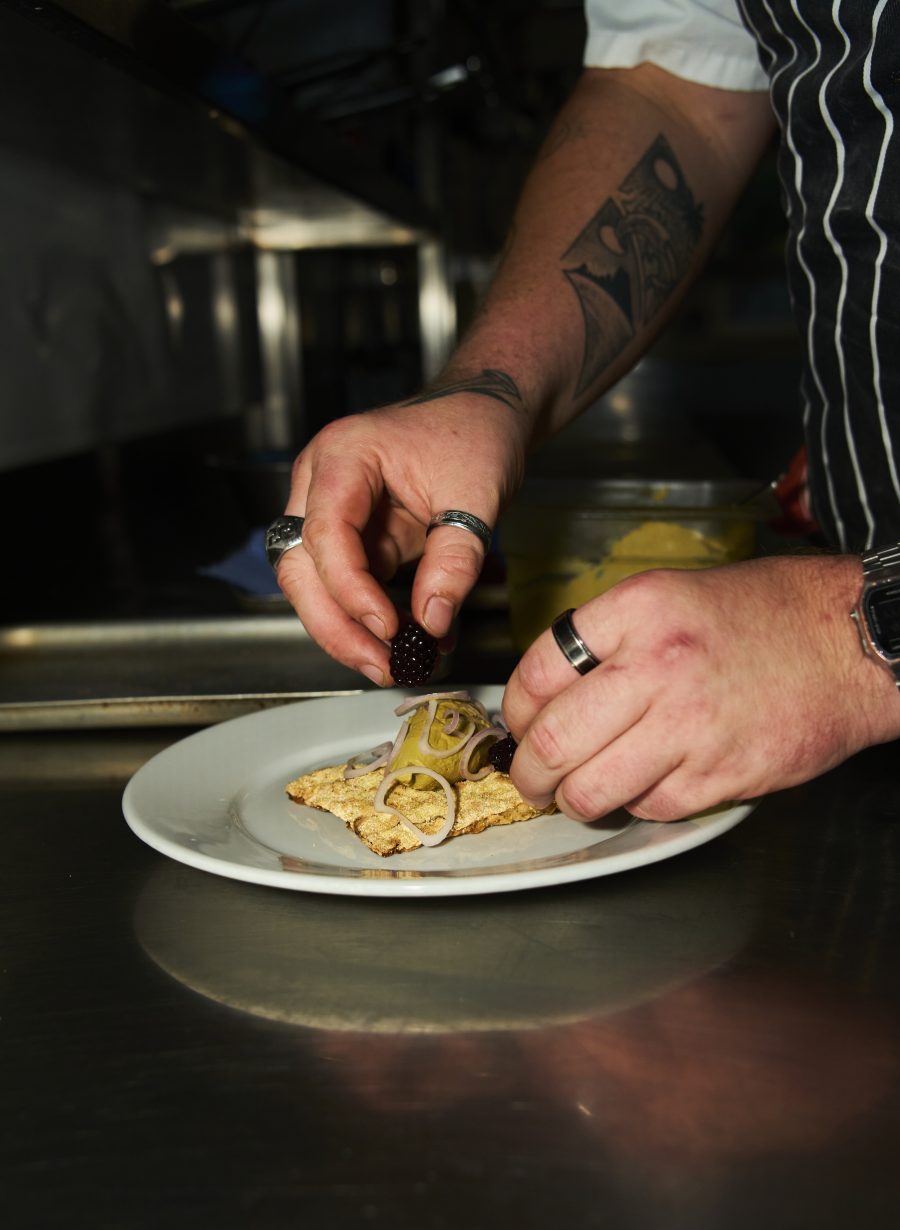 chef preparing food in pub kitchen