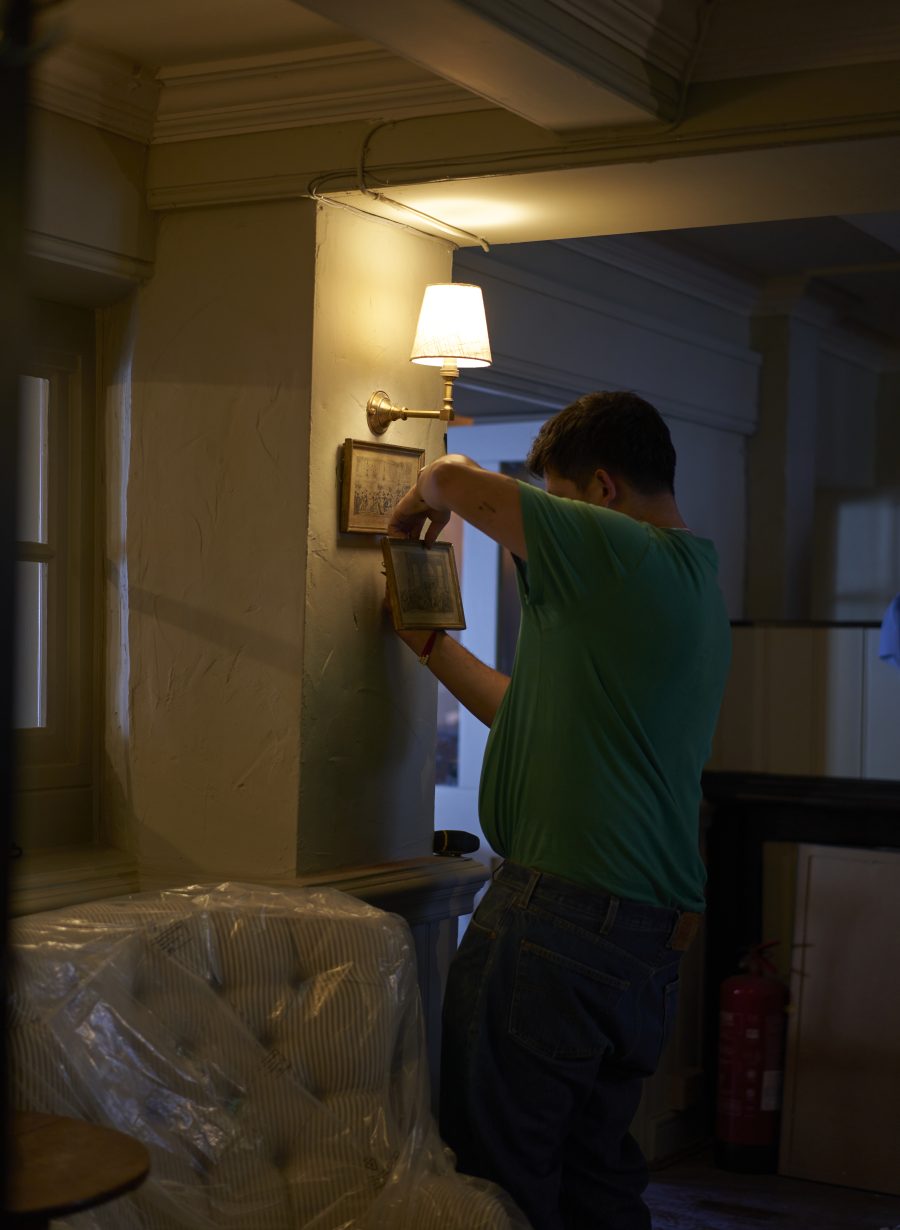 taff member preparing pub room