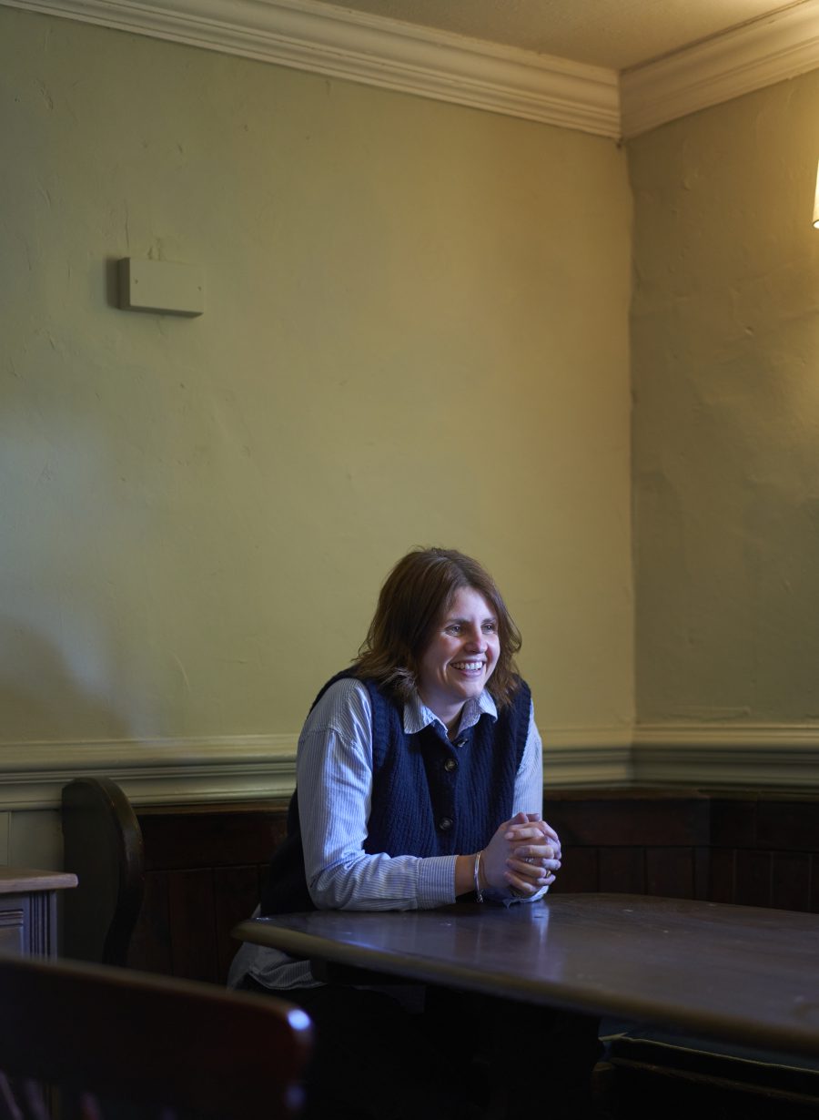 team member sitting inside the pub